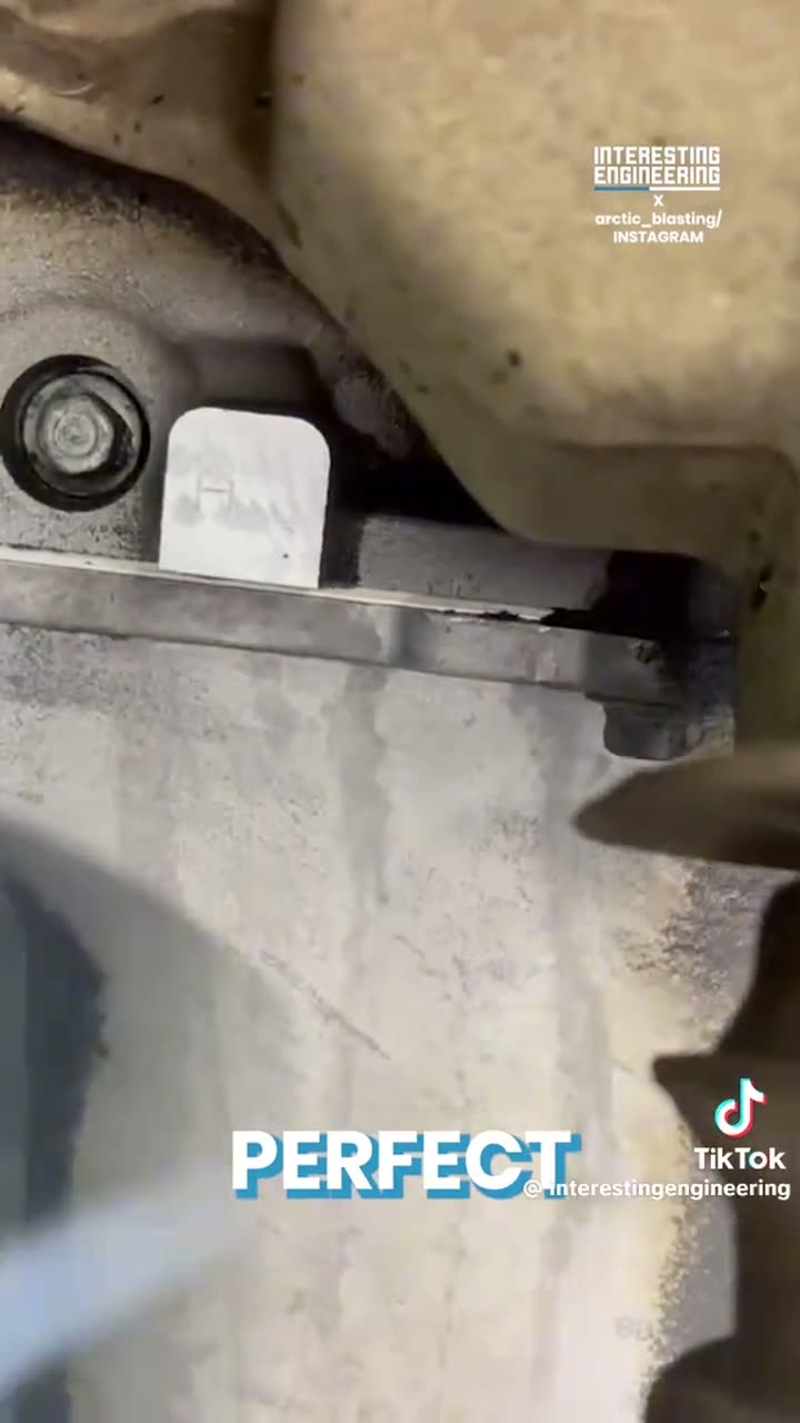 Dry ice blasting cleaning years of grime off an engine bay.